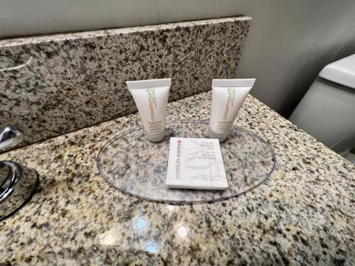 a table with two cups on top of a counter at Thriftlodge Saskatoon in Saskatoon