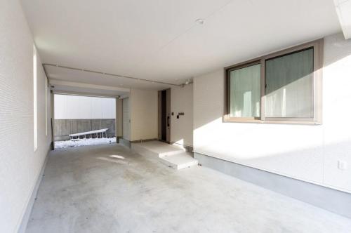 an empty room with a window in a building at The MOON in Sapporo