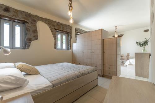 a bedroom with a large bed in a room at Marousas Place in Agkidia