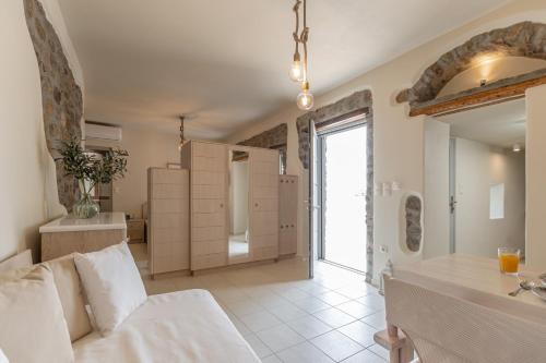 a large bathroom with a sink and a bath room at Marousas Place in Agkidia