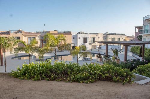 a view of a city with palm trees and buildings at Private Villa in Gated Community Pet-Friendly in Cabo San Lucas