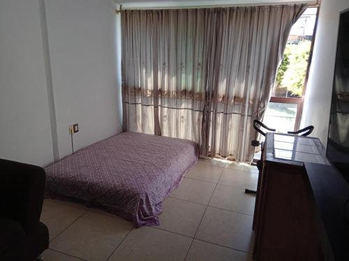 Кровать или кровати в номере Renta de Habitación Amueblada con servicios incluidos