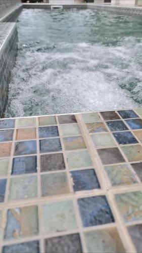 a pool of water with tiles on the ground at Villa for rent in Albion