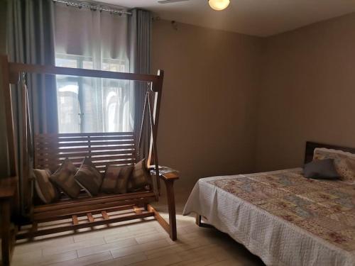 a bedroom with a bed and a window at Villa for rent in Albion