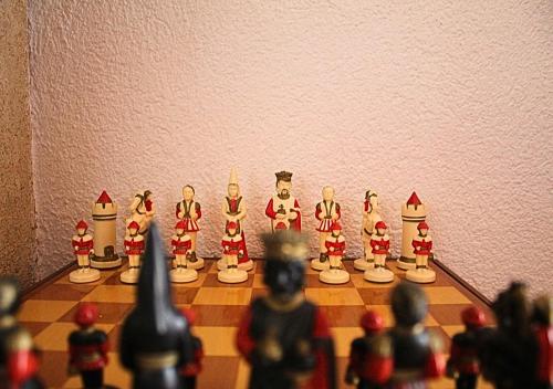 a chess board with a group of toy figurines on it at Villa Finestra sul Castello in Partinico