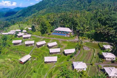 an aerial view of a farm with a group of tents at Kaura Manggis, Bali - Luxury Tent in Candidasa
