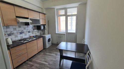 Kuhinja oz. manjša kuhinja v nastanitvi FlatRent Apartment