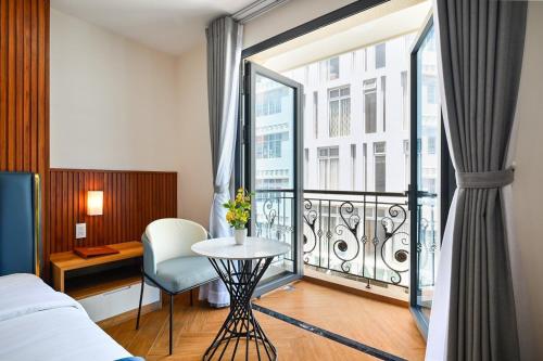 Postel nebo postele na pokoji v ubytování PLUS VUNG TAU HOTEL