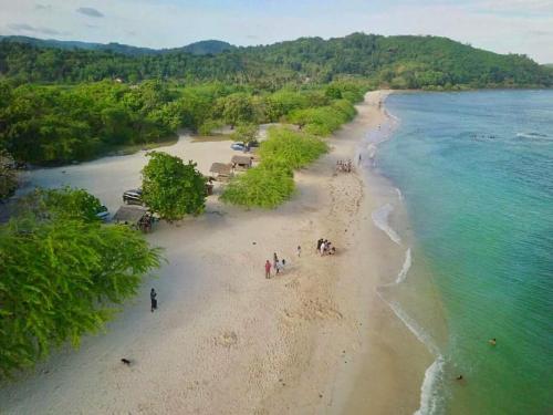 a group of people walking on a beach at Peaceful and Romantic Country Home in Kabalwa