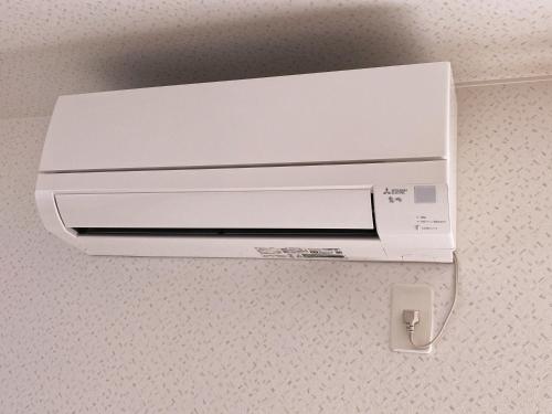 a white printer sitting on top of a wall at Furano CUBE SUGAR-方糖民宿,步行8min到雪场,3 brs,Max 6ppl in Furano