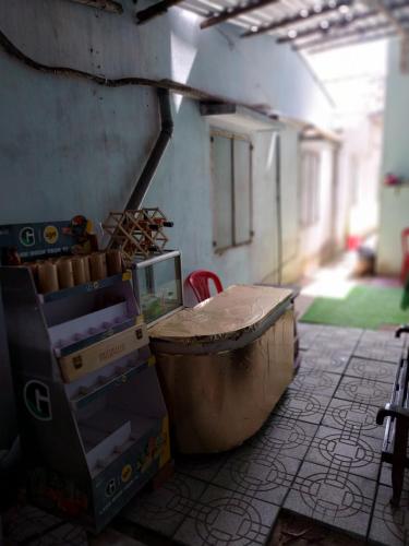 a room with boxes and a table in a building at BenTrestay in Giồng Tú Ðiền