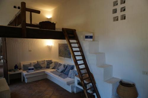 Ένα ή περισσότερα κρεβάτια σε δωμάτιο στο Sa Selvaggia by Holiday World