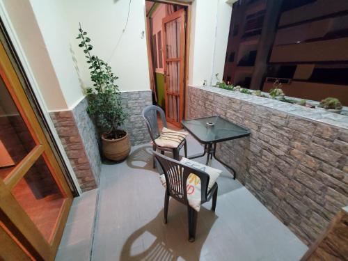 a small patio with two chairs and a table at Beautiful apartement in the heart of tangier in Tangier