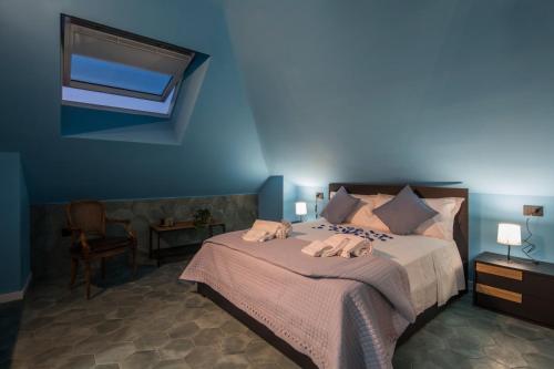 a bedroom with a bed with two towels on it at Gioia Home in Pompei