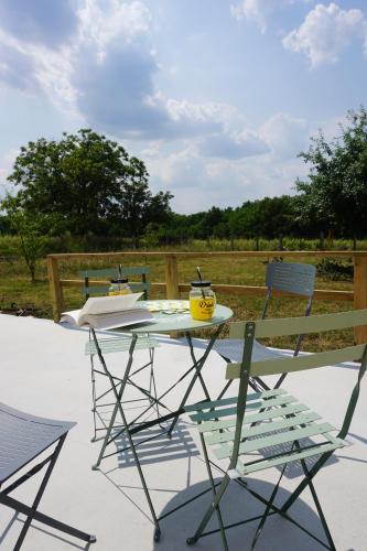 a table and chairs sitting on a patio at Riva Home in Saint-Aignan