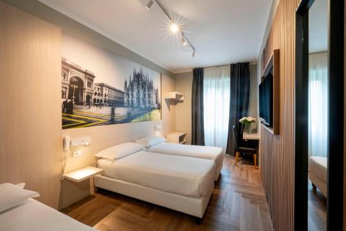 Кровать или кровати в номере Kleos Hotel Milano Città Studi by Kleos Group Collection