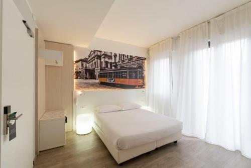 Кровать или кровати в номере Kleos Hotel Milano Città Studi by Kleos Group Collection