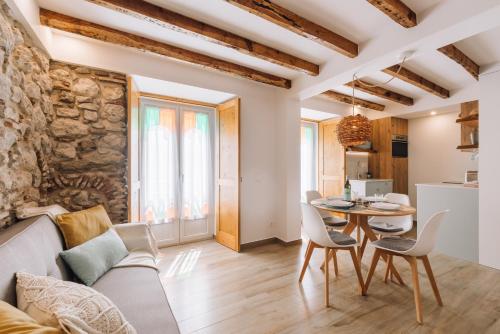 a living room with a couch and a table at Casa do Tio Farinha by RNvillage in Sesimbra