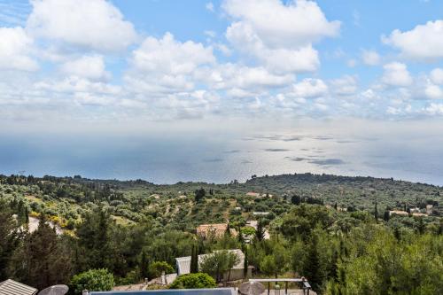 a view of the ocean from a hill at Serenity Boutique Suites in Athanion