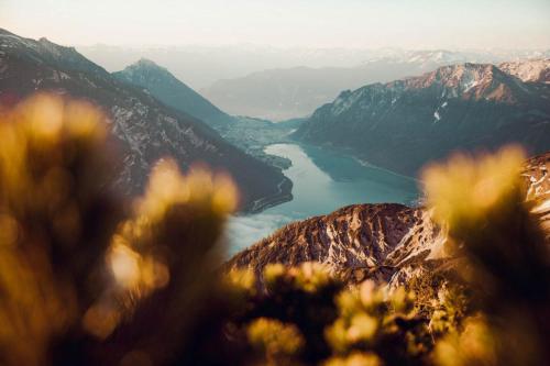 a view of a lake from the top of a mountain at Hotel St. Georg zum See in Maurach