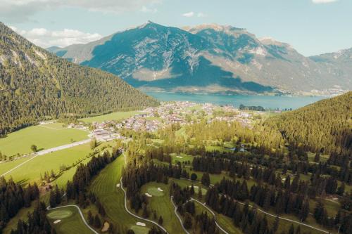 an aerial view of a small town in the mountains at Hotel St. Georg zum See in Maurach