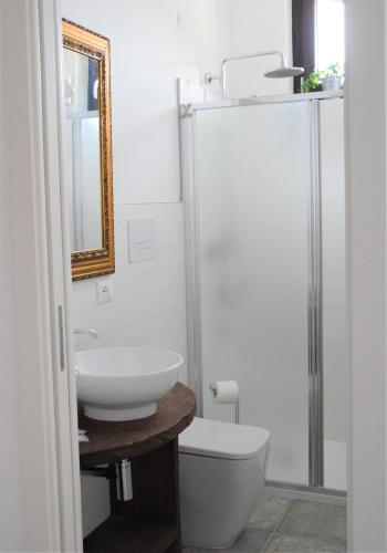 a bathroom with a toilet and a sink and a shower at b&b Adamà in Atena Lucana