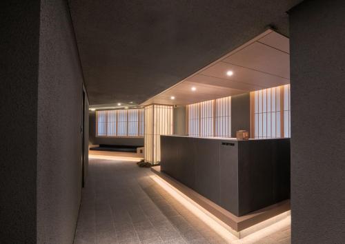 a hallway with a reception desk in a building at UH Suite Central Seoul in Seoul