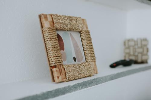 a wooden picture frame sitting on a shelf at Apartman Nikola in Gospić