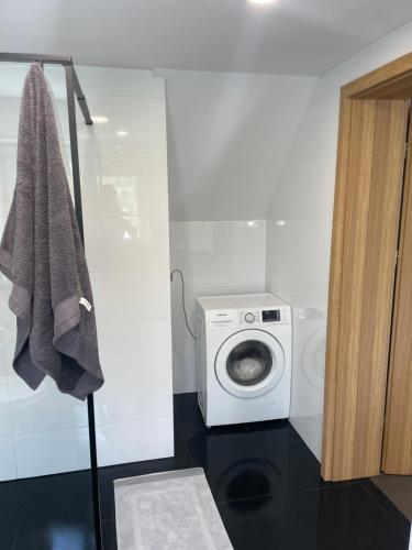 Koupelna v ubytování Apartament Dzierzecin