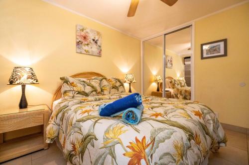 En eller flere senge i et værelse på Kuleana Resort 302