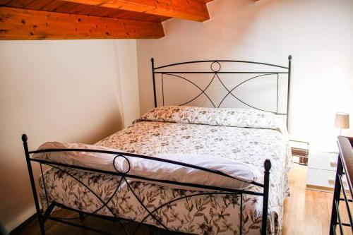 Łóżko lub łóżka w pokoju w obiekcie Casa vacanze ‘A Catina’