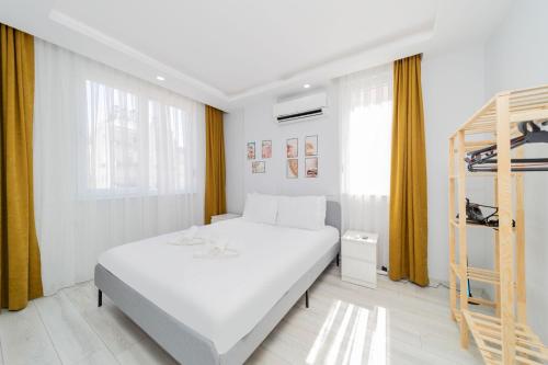 Postel nebo postele na pokoji v ubytování Cozy Flat w Balcony 15 min to Beach in Antalya