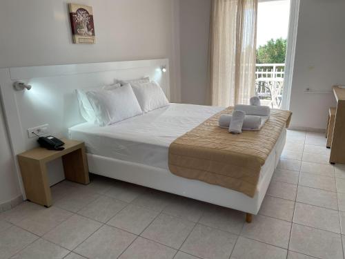 Postel nebo postele na pokoji v ubytování Armonia Hotel by Zante Plaza