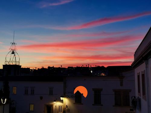 a view of a sunset from a building with a sky at #056 Old Post Office by Home Holidays in Albufeira