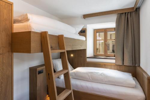 Ένα ή περισσότερα κρεβάτια σε δωμάτιο στο Adlhof Apartments