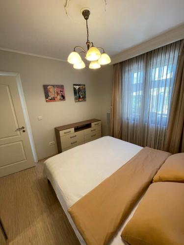 a bedroom with a large bed and a window at Holiday Home Barska Vila in Bar