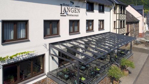 an angled view of the entrance to a building at Hotel-Restaurant Langen in Kattenes