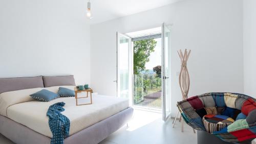 a living room with a couch and a chair at VILLA PETRILLO 6, Emma Villas in Passo di Mirabella