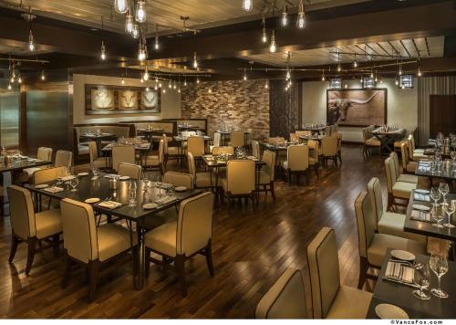 a kitchen filled with tables and chairs at Hard Rock Hotel & Casino Lake Tahoe in Stateline
