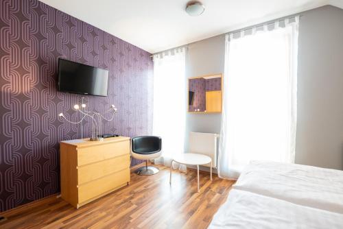 TV a/nebo společenská místnost v ubytování Hotel Garni Pod Skalkou