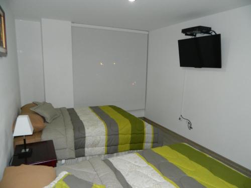 TV a/nebo společenská místnost v ubytování ItsaHome Apartments - Torre Seis