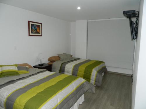 Postel nebo postele na pokoji v ubytování ItsaHome Apartments - Torre Seis