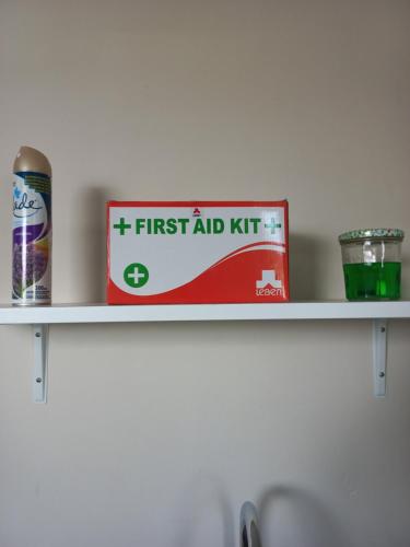 a first aid kit sitting on a shelf at Bois Mapou Self Catering Apartments Unit 103 in Rivière Noire