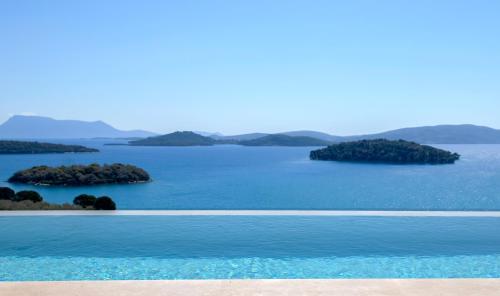a view of a large body of water with islands at Smirties Villas in Nydri