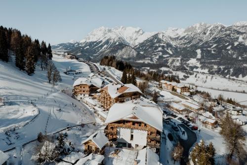 an aerial view of a ski resort covered in snow at Natur- und Wellnesshotel Höflehner in Haus im Ennstal