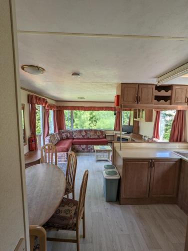 a kitchen and living room of an rv at Glebe Farm Holidays in Newport