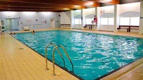 a large swimming pool with people in the water at Tranquility - Static Caravan Lune Park on Parkdean Ocean Edge Resort in Heysham