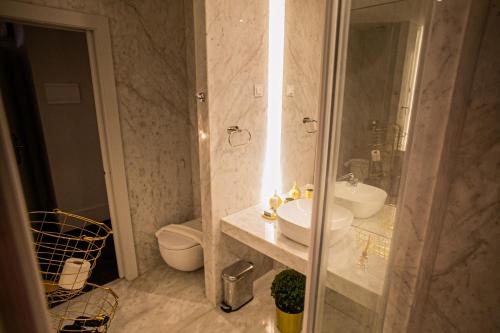 a bathroom with a sink and a toilet at 262 Boutique Aliados in Porto