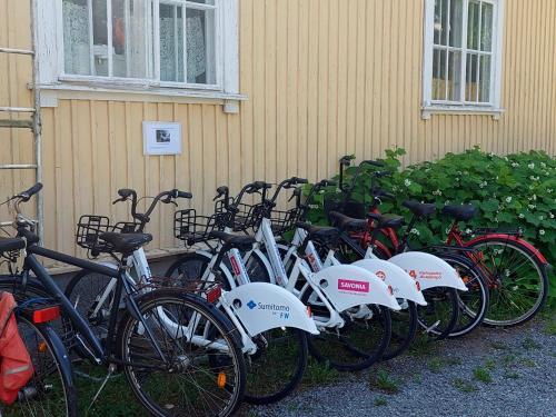 a row of bikes parked next to a building at Residenssi Tuuli in Varkaus