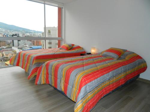 Postel nebo postele na pokoji v ubytování ItsaHome Apartments - Torre Seis
